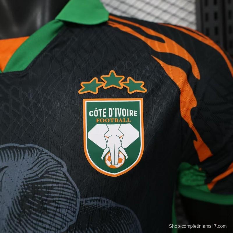 Player Version 2025 Ivory Coast Black with Elephant Graphic and Orange Stripes Jersey